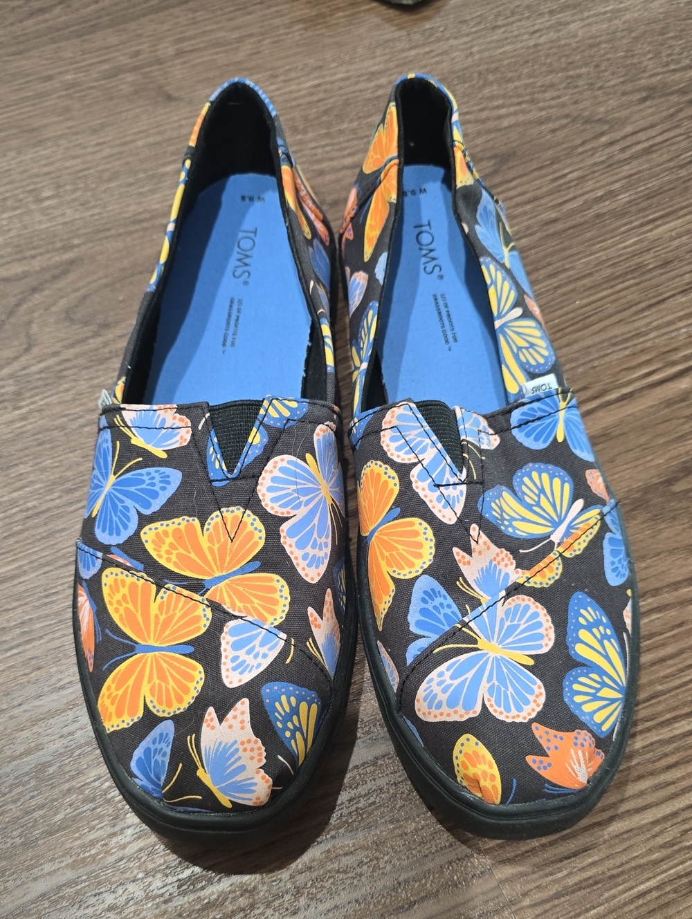 Toms Black Slip-On Flats with Orange & Blue Butterfly Print 9.5